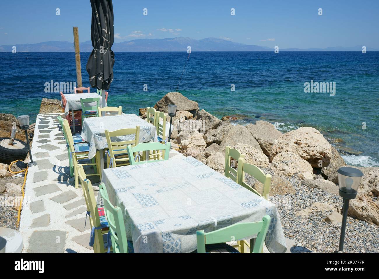 Tables on the Beach in Likoporia, Korinthia, Peloponnese, Greece Stock Photo