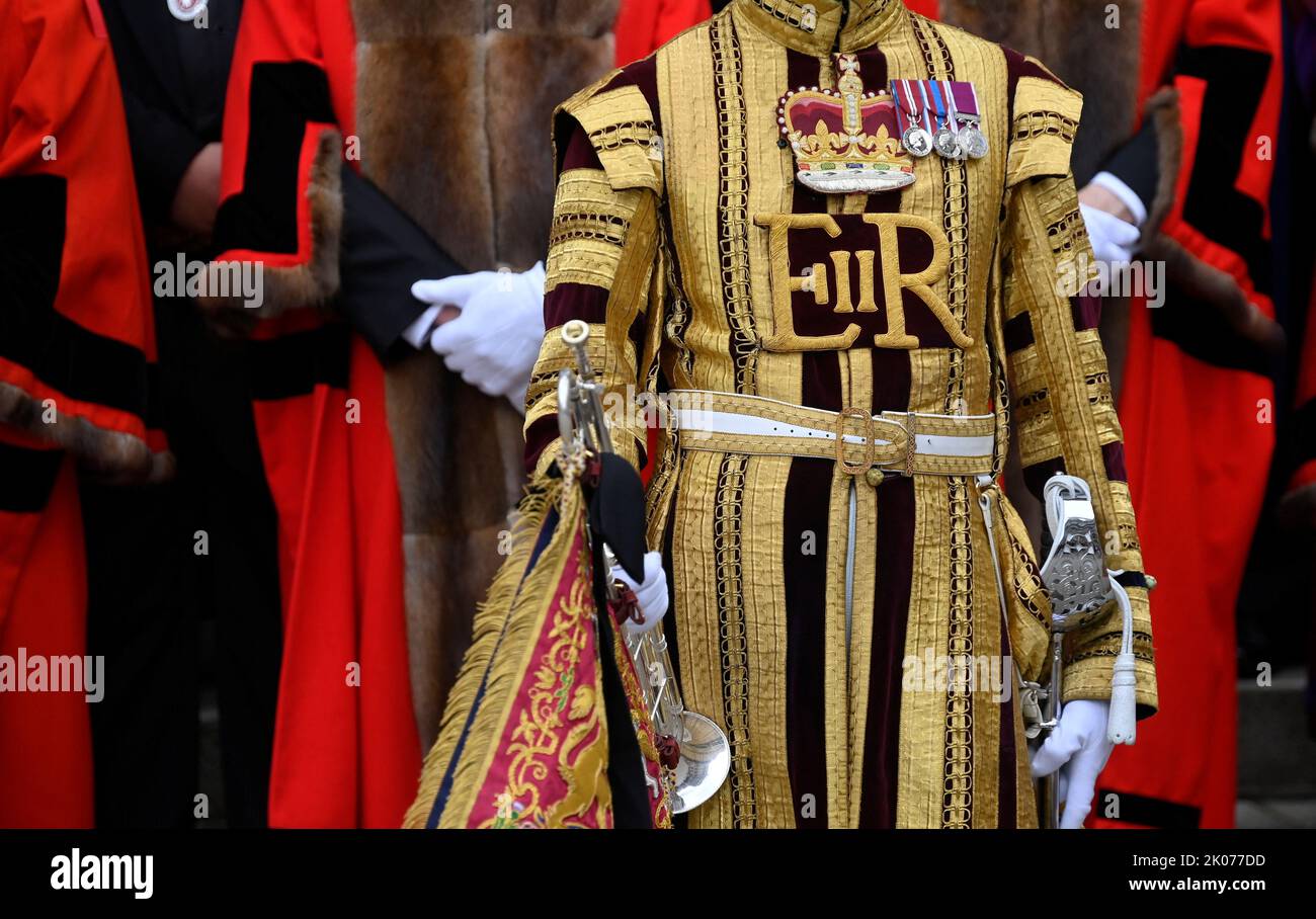 a-band-member-wearing-a-ceremonial-uniform-with-the-royal-cypher-of-the