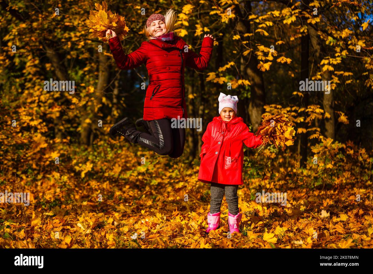Mother and daughter in a autumn park Stock Photo - Alamy