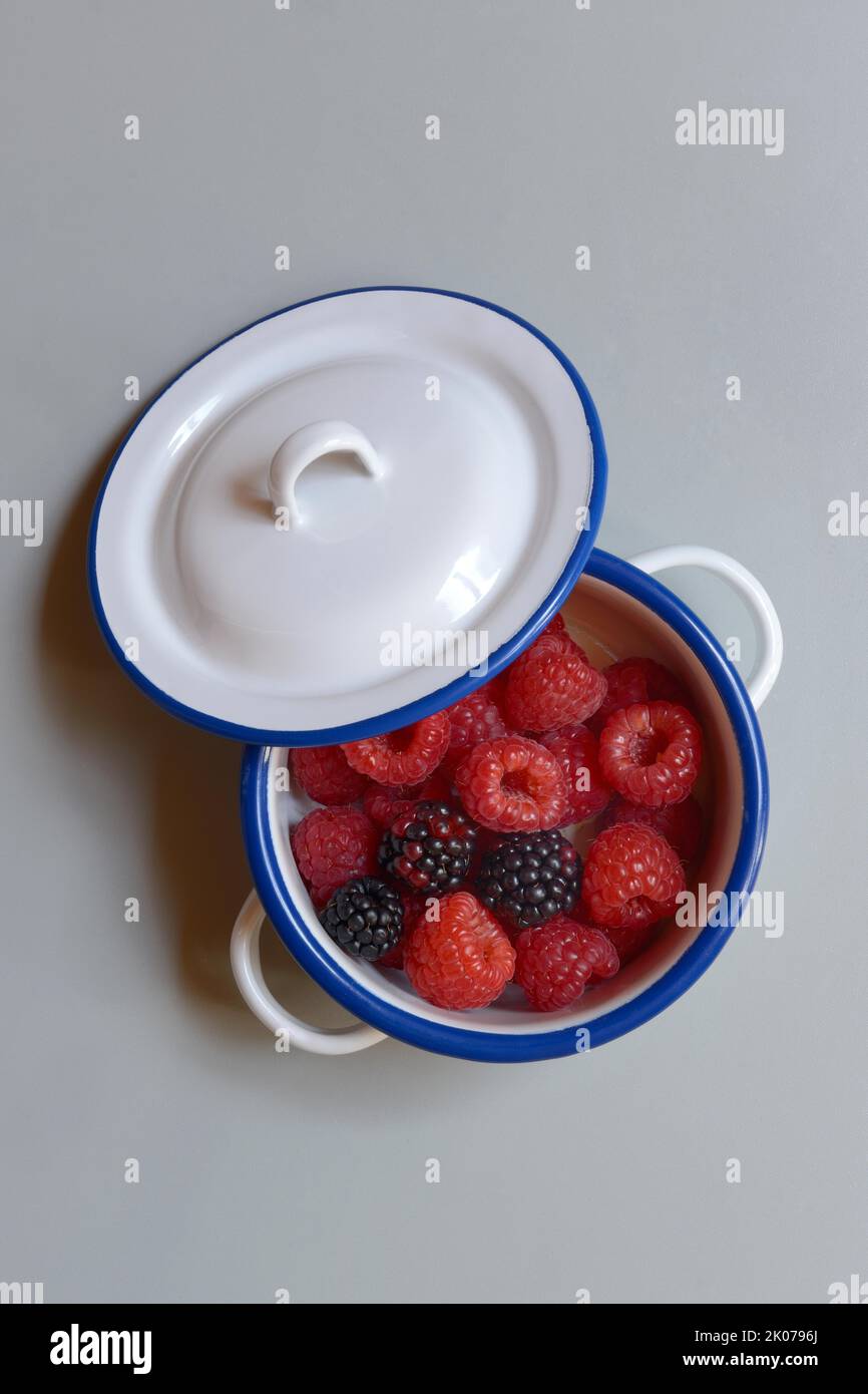 Raspberries and blackberries in pots, fruit, berries Stock Photo Alamy