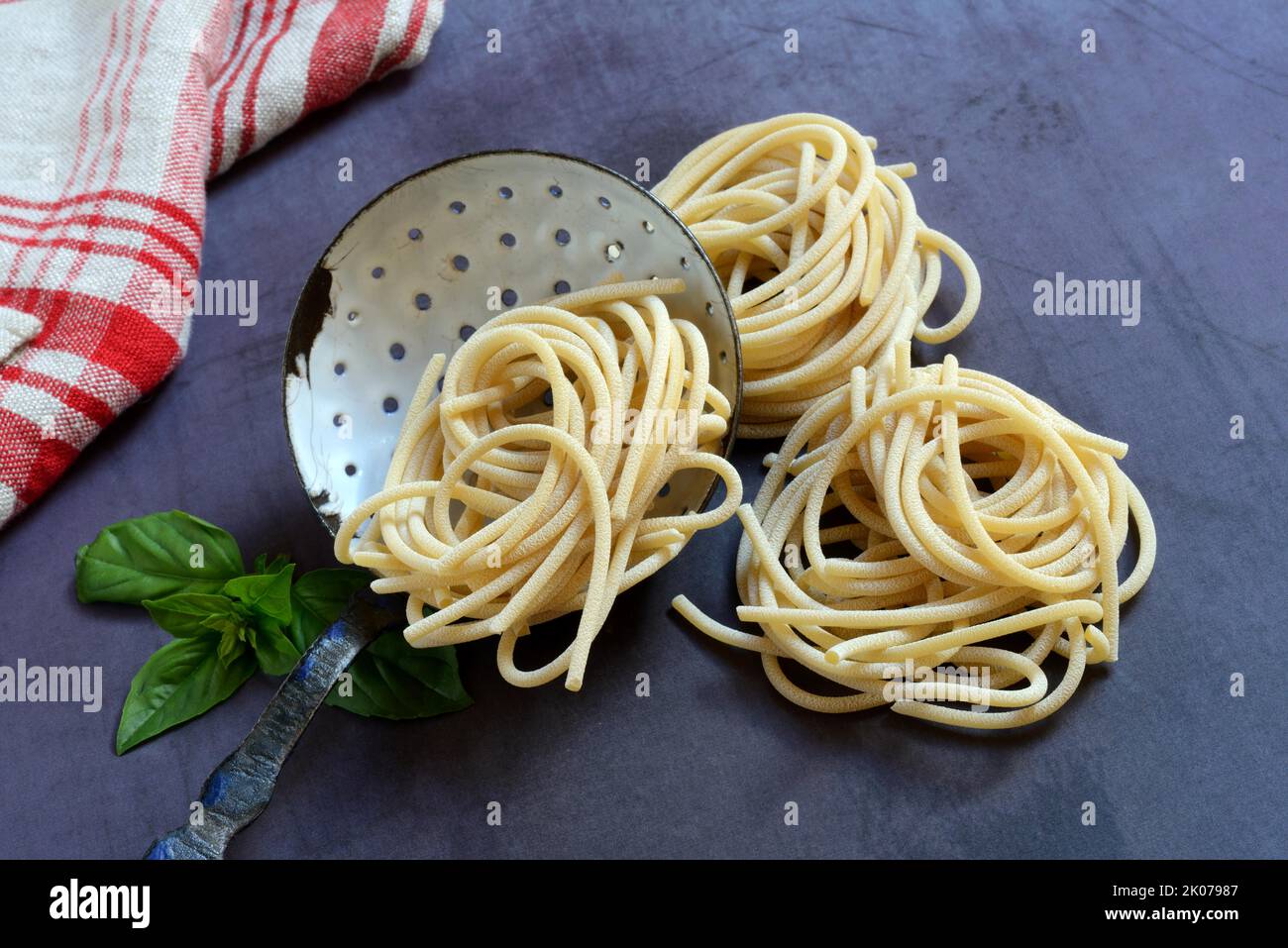 Pici, Italian pasta, pasta nests with sieve ladle, pasta, noodles Stock Photo Alamy