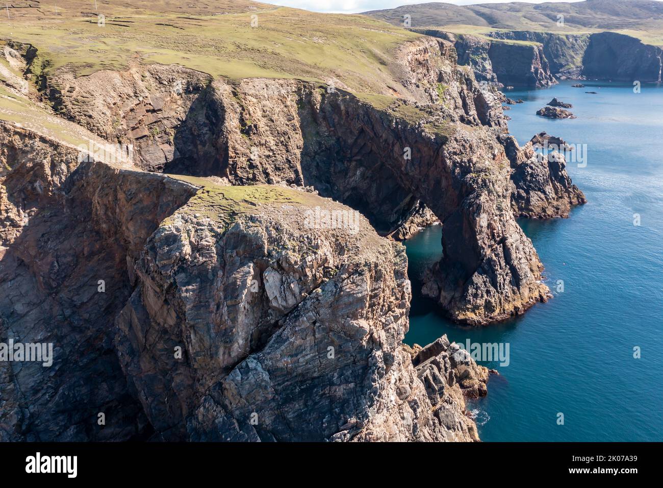Aerial view of the cliffs near the lighthouse on the island of Arranmore in County Donegal, Ireland. Stock Photo
