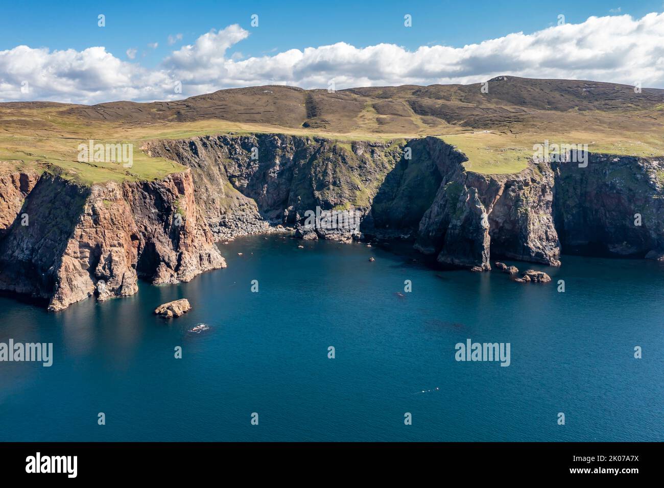 Aerial view of the cliffs near the lighthouse on the island of Arranmore in County Donegal, Ireland. Stock Photo