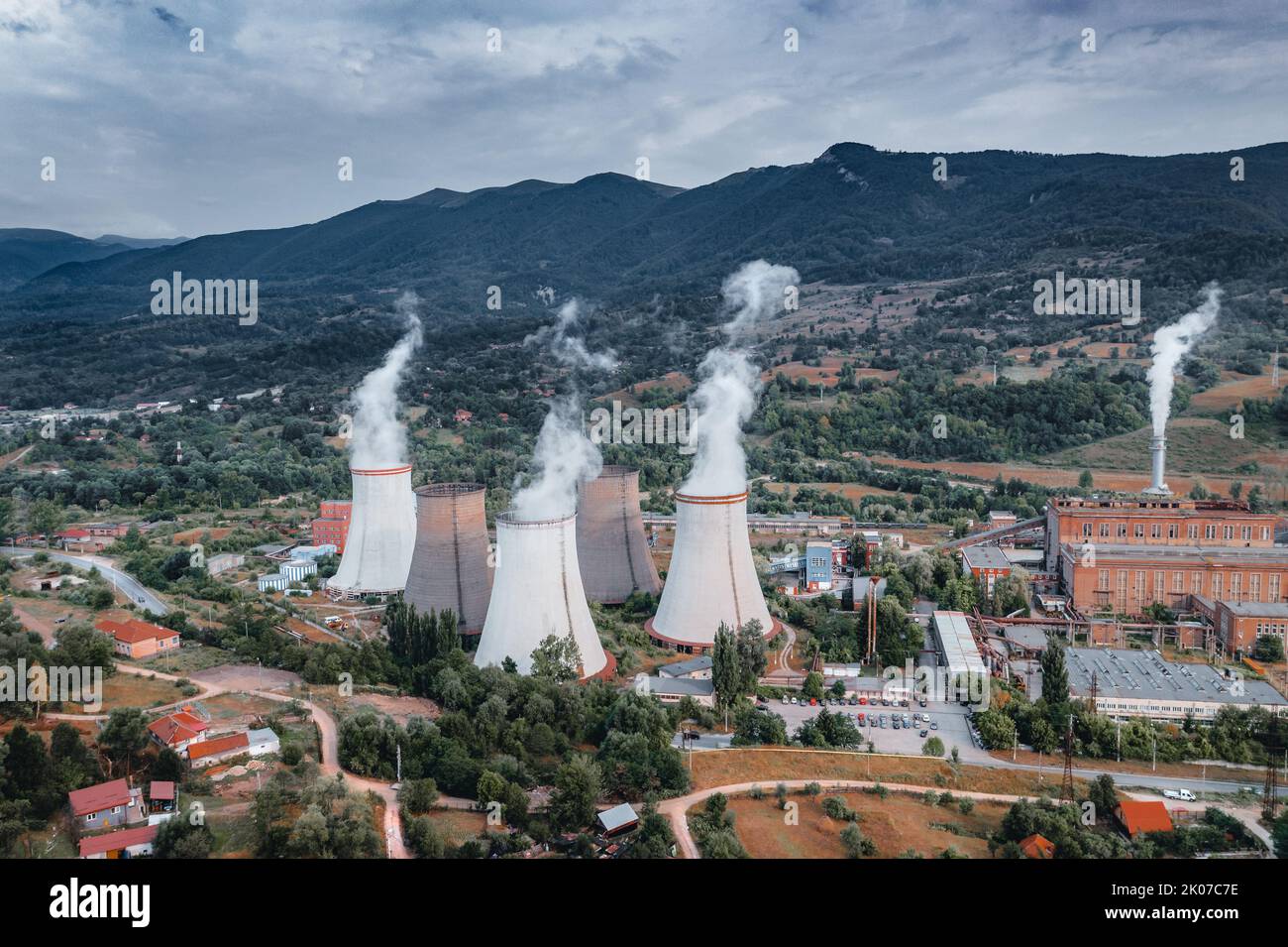 Active chimneys smoke in August. Stock Photo