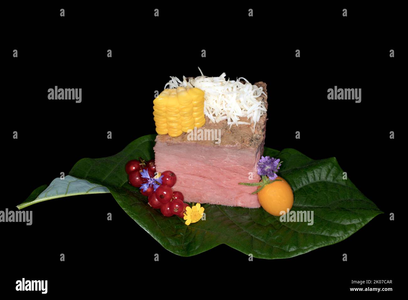 Pink roast beef with freshly grated horseradish, corn kernels, yellow