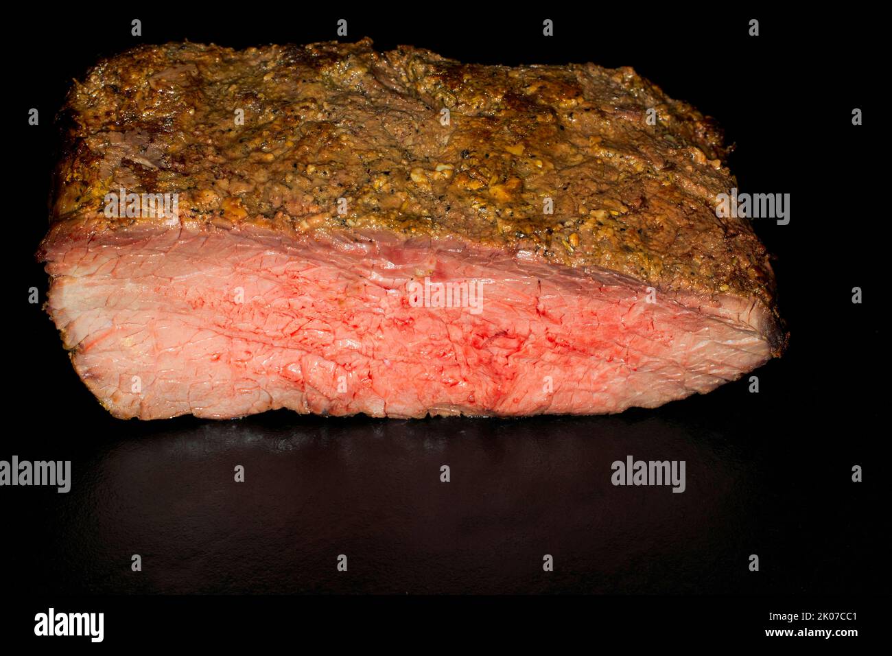 Pink roast roast beef, food photography with black background Stock