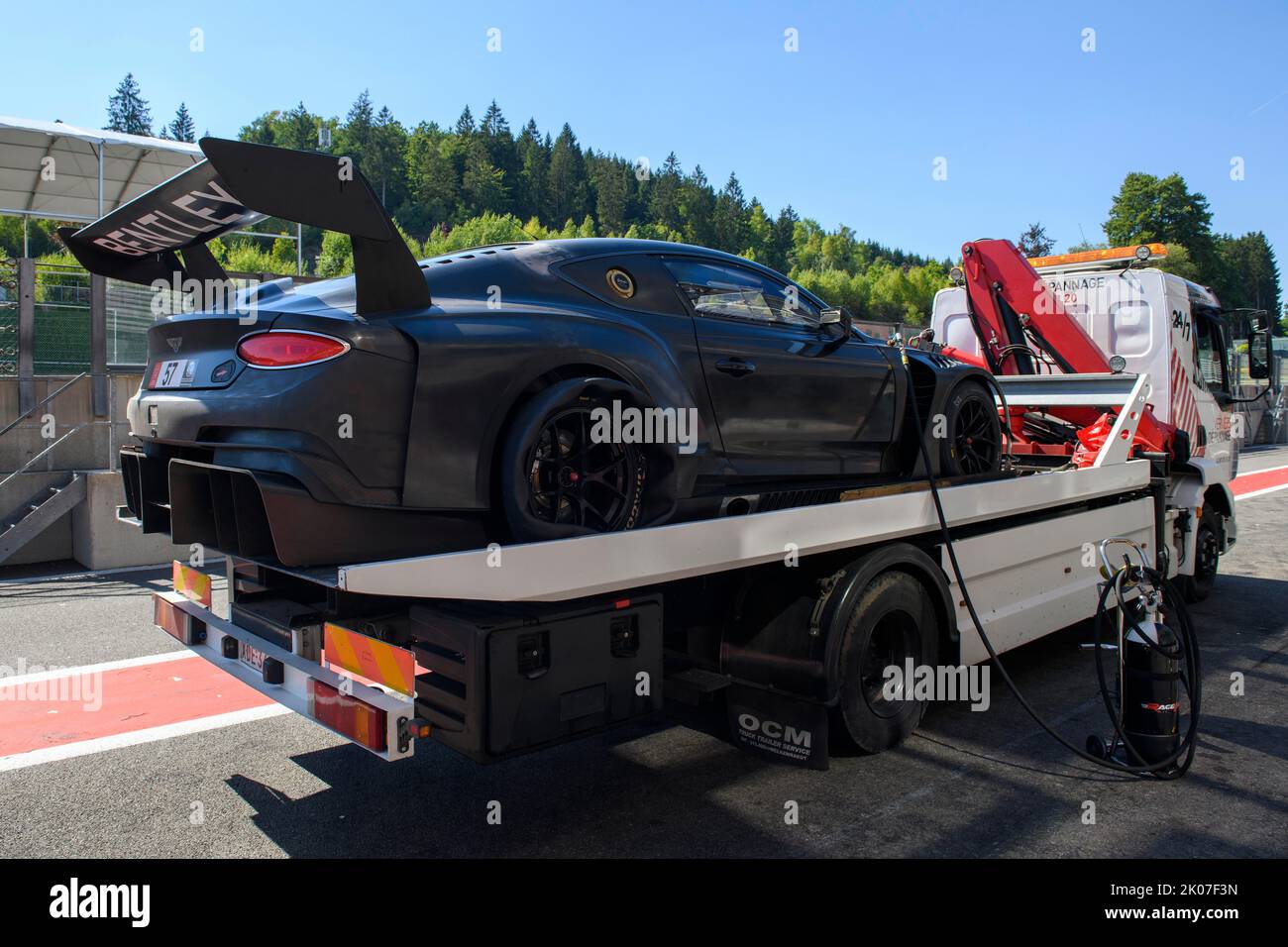 Bentley GT3 race car is brought back to pit lane Pit Lane of circuit by ...