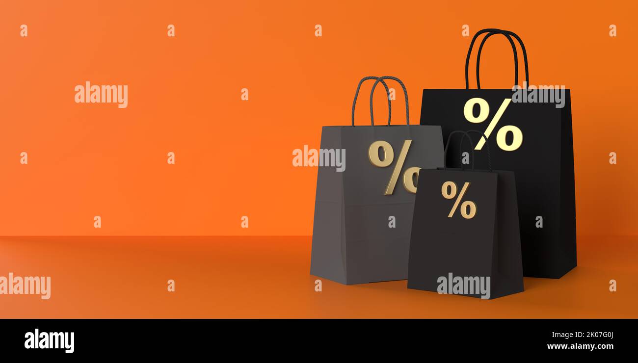 Halloween Sale promotion with luxury black paper percentage bags on orange background, copy space. Seasonal shopping card, web banner, sale, discount Stock Photo