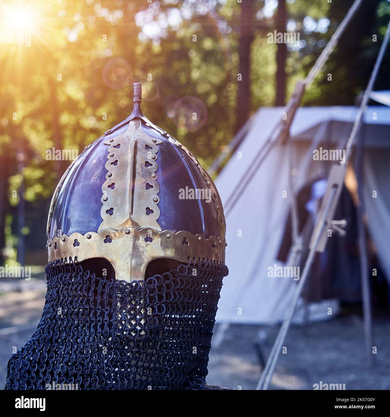 Medieval dark helmet with chain mail and golden applications Stock Photo