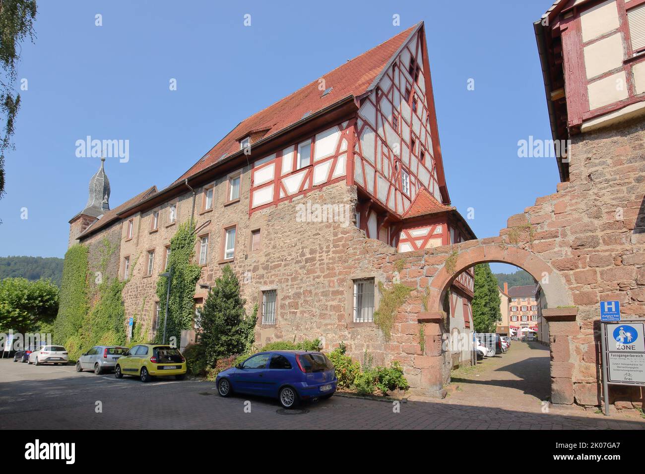 Historic town wall with blue hat and half-timbered house in Eberbach, Neckar Valley, Baden-Wuerttemberg, Germany Stock Photo