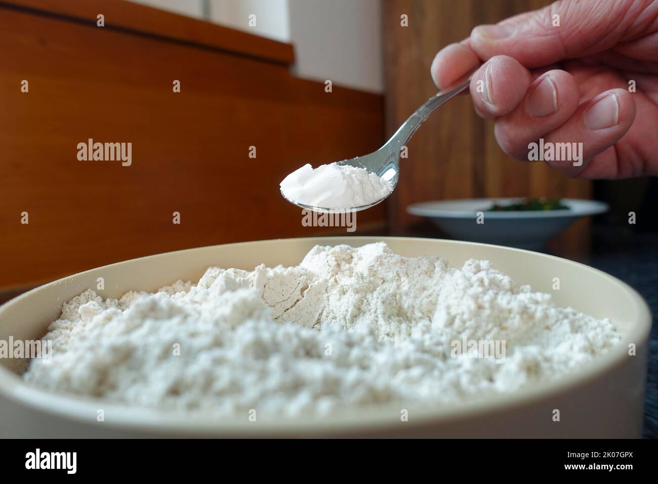 Swabian cuisine, preparation of chard cake, add baking powder to flour