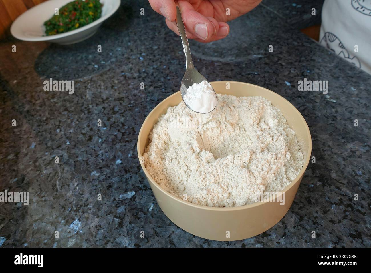 Swabian cuisine, preparation of chard cake, add baking powder to flour