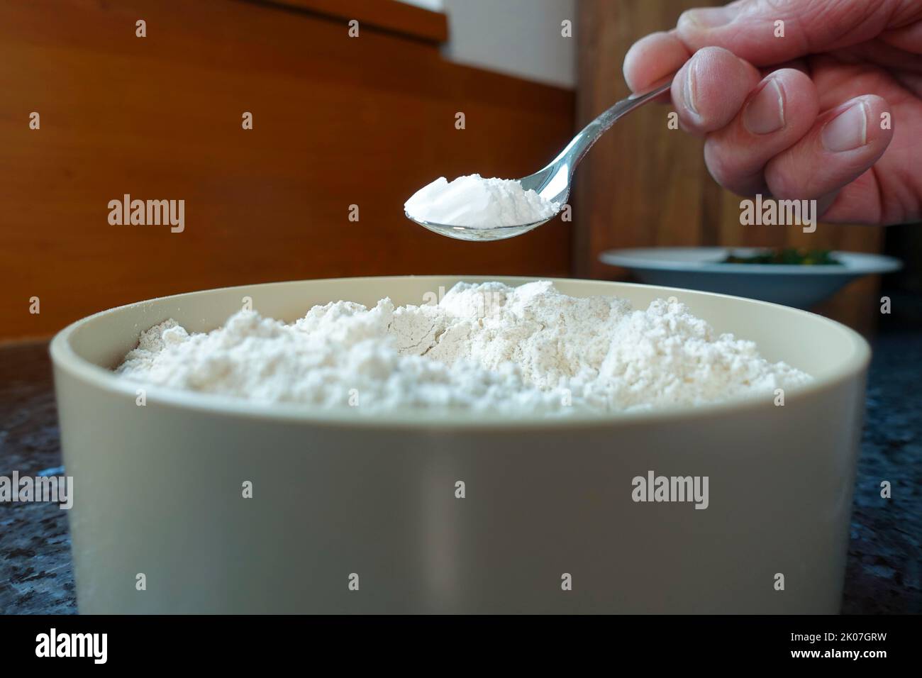 Swabian cuisine, preparation of chard cake, add baking powder to flour