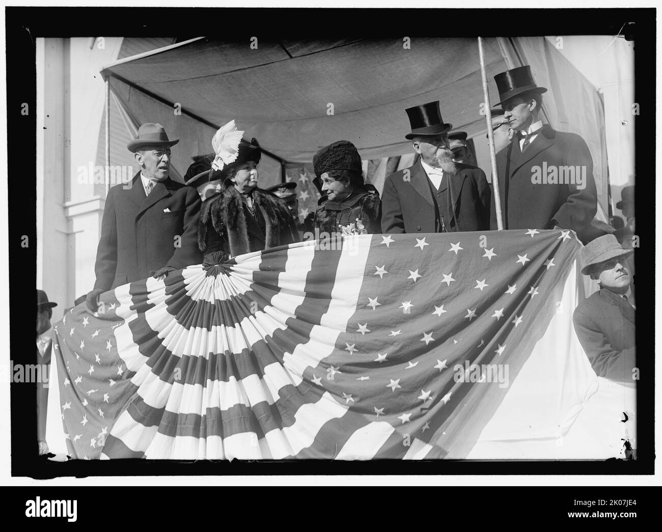 Woodrow Wilson and wife Ellen with unidentified on viewing stand