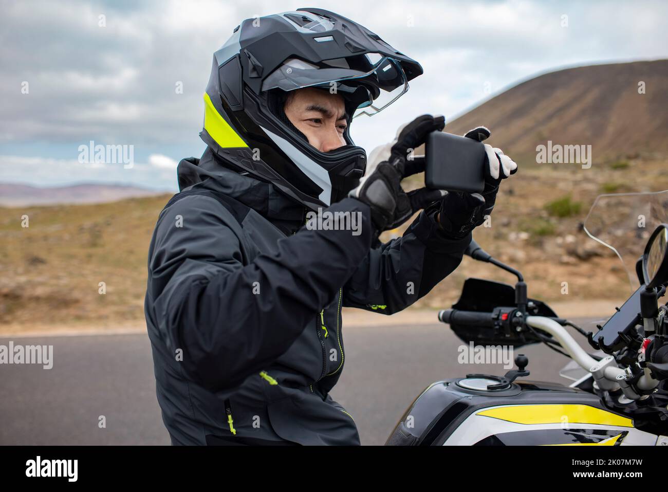Chinese mid adult man riding motorcycle Stock Photo - Alamy