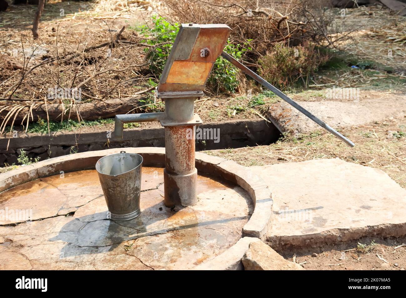 Hand Pump old method of extracting water from well in India Stock Photo