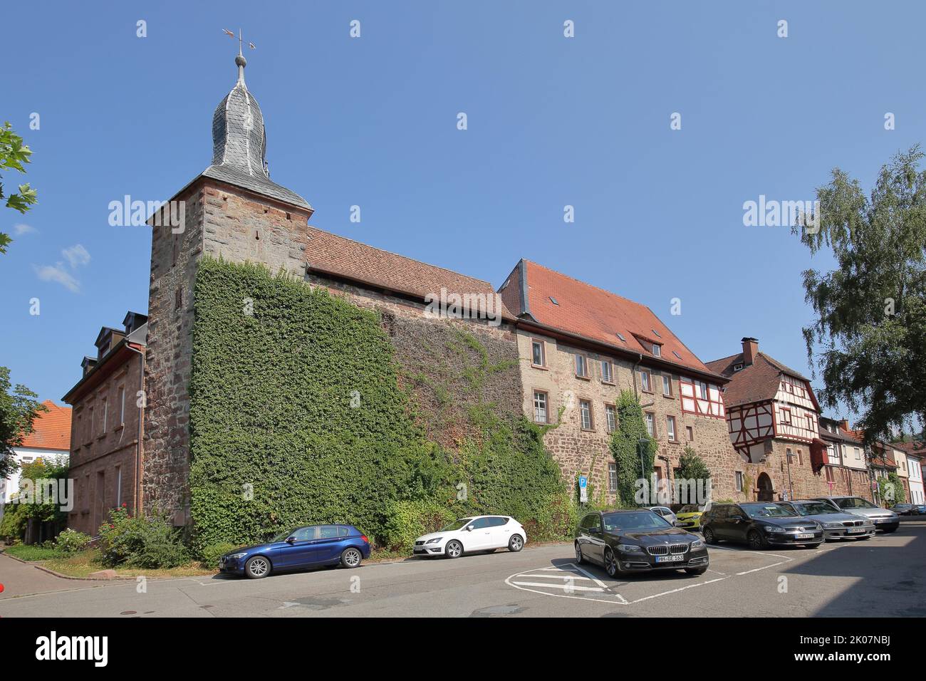 Blue hat and historic town wall in Eberbach, Neckar Valley, Baden-Wuerttemberg, Germany Stock Photo