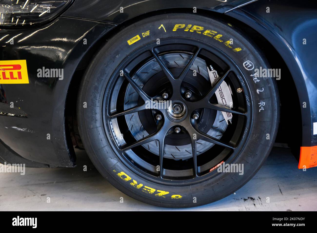 Racing tyres with markings of racing mechanic lettering mounted on