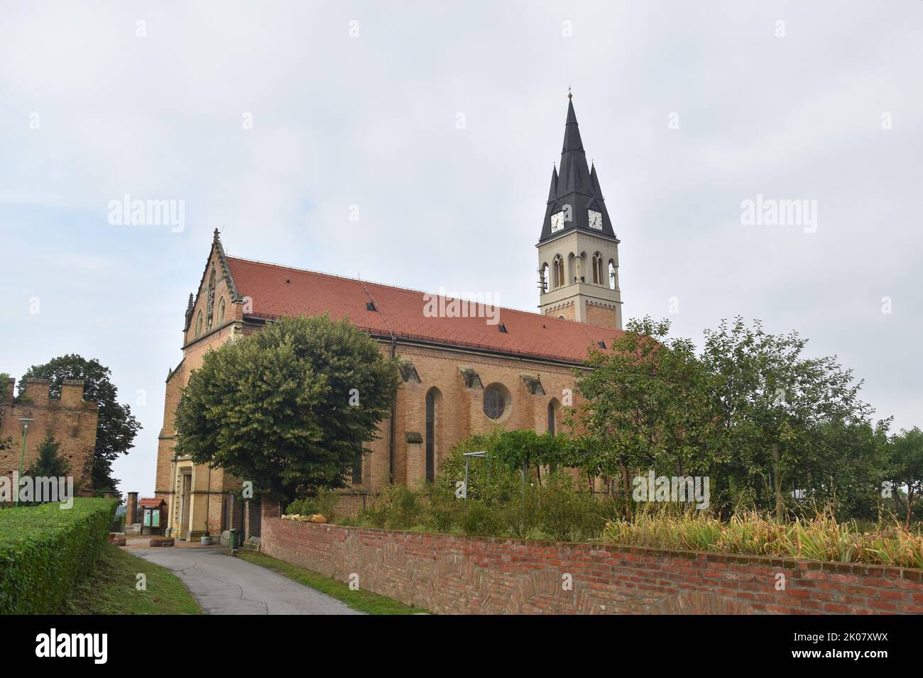 Border town of Ilok in Eastern Croatia (Slavonia, Srijem) by the Danube river: Catholic church and castle above the river Stock Photo