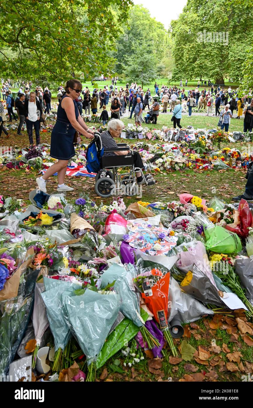 London UK 10th September 2022 - Crowds pay their respects and continue to bring flowers to Green Park in London in tribute to Queen Elizabeth II after her death was announced last on Thursday . The flowers have been moved from outside Buckingham Palace on the day King Charles III was also proclaimed as monarch : Credit Simon Dack / Alamy Live News Stock Photo