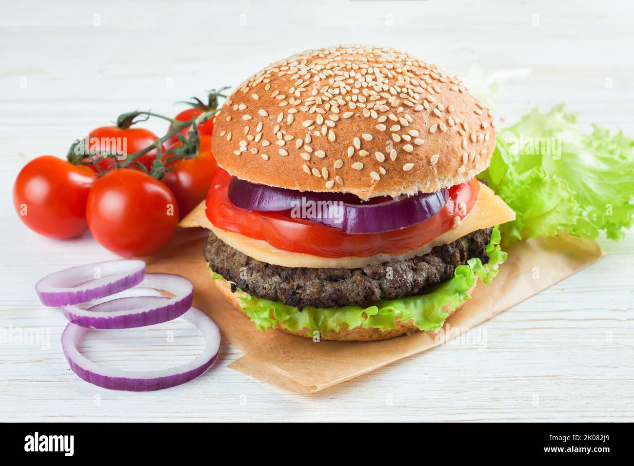 Burger bread with sesame is heating on a grill pan. Process of cooking self  made burgers at home Stock Photo - Alamy