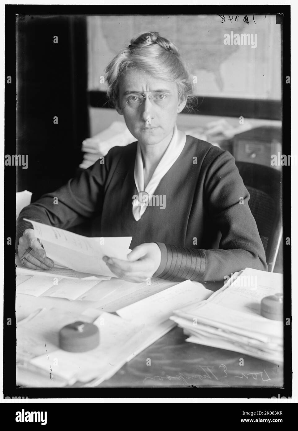 D.E. Thompson, between 1913 and 1918. Woman with paperwork. Stock Photo