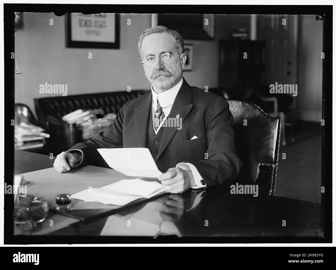 John Skelton Williams at Desk, between 1913 and 1918. American financier, US Comptroller of the Currency, first president of the Seaboard Air Line Railway. Stock Photo
