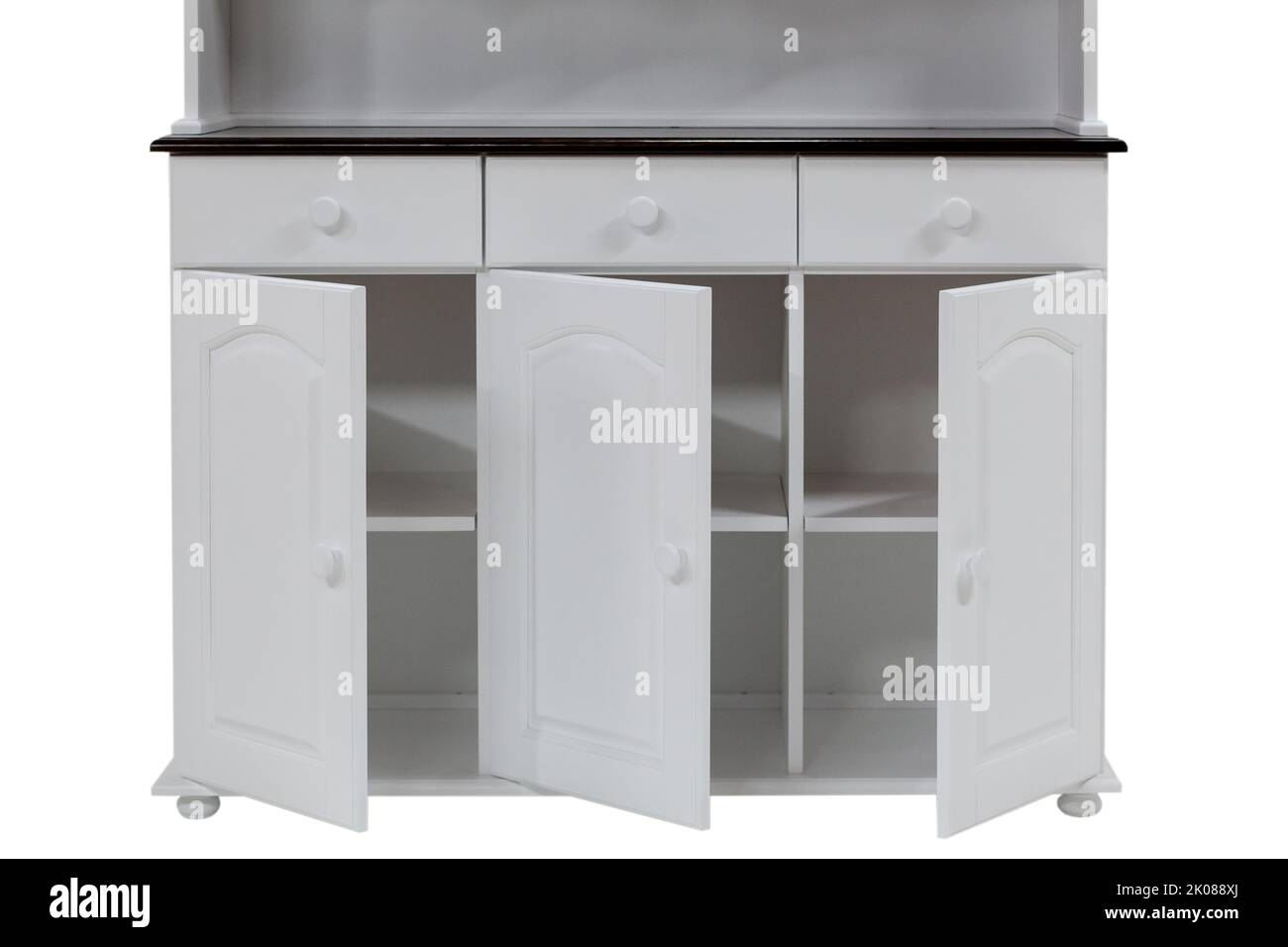 Open doors of a white wooden kitchen Closeup of empty kitchen