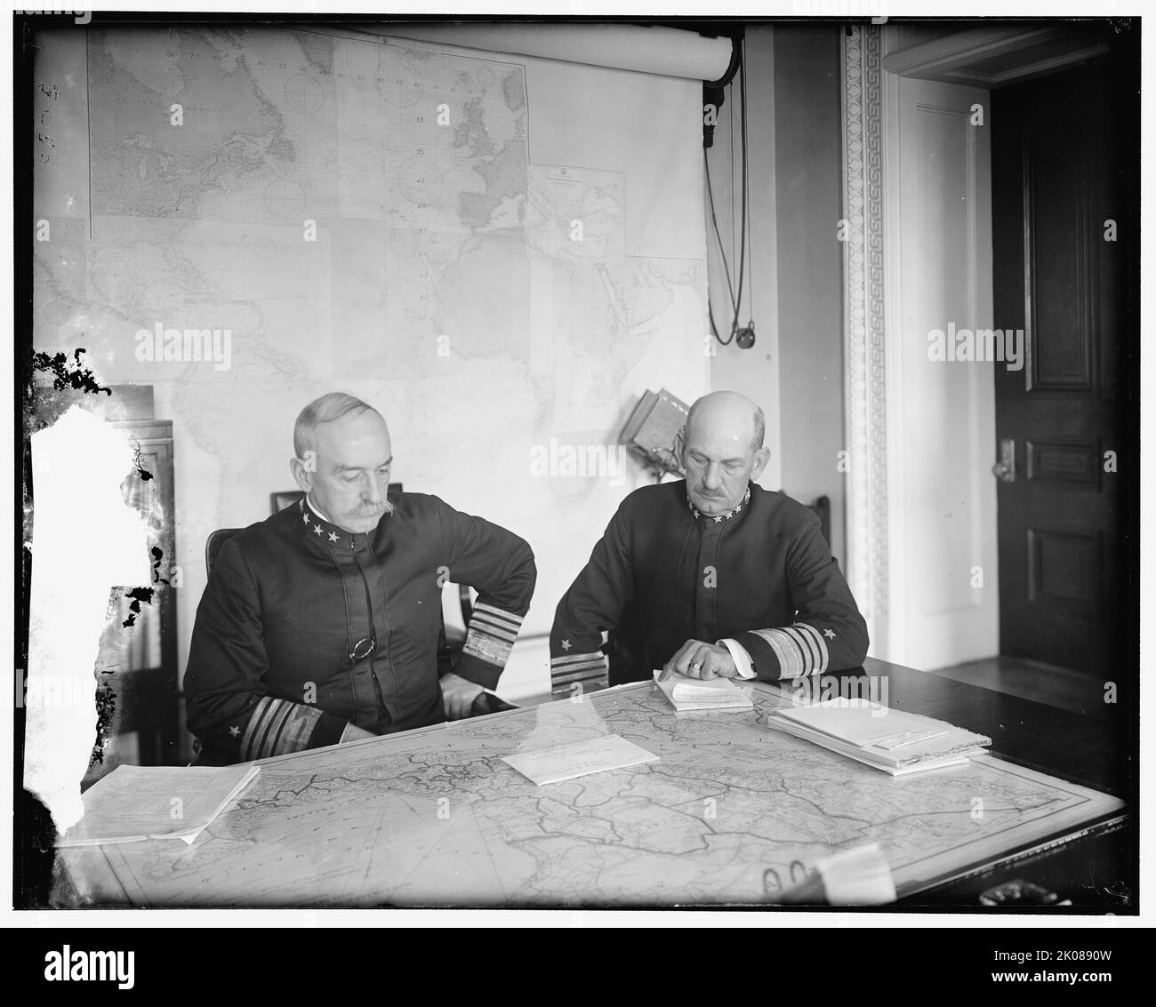 Benson and Mayo, between 1910 and 1920. US admirals William Shepherd Benson and Henry Thomas Mayo looking at a map of Mexico. Notepaper headed 'Office of Naval Operations'. Mayo commanded the naval squadron involved in the Tampico incident of 9 April 1914. Stock Photo