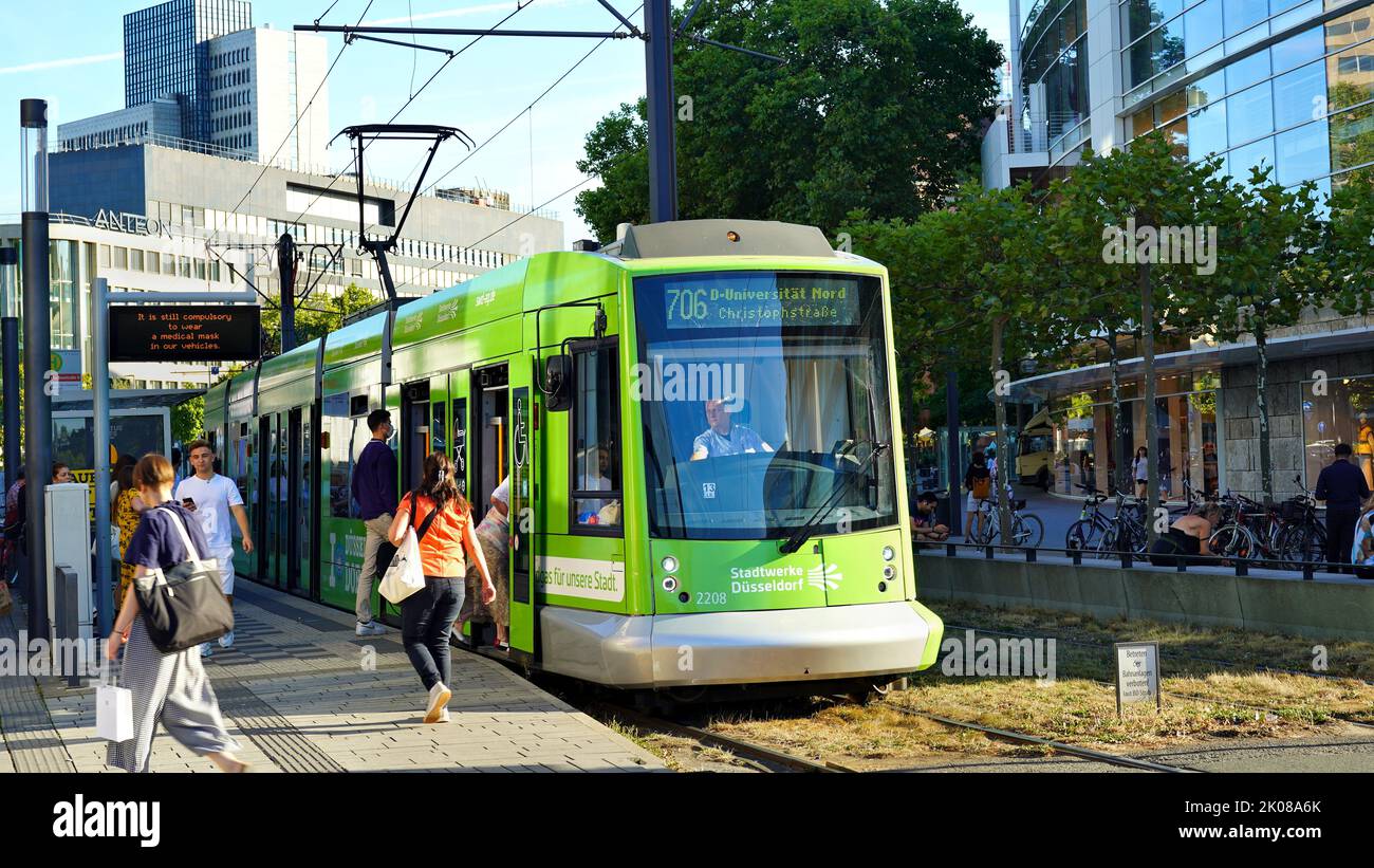 Rheinbahn tram line 706 stopping at a station in front of the department store „Peek & Cloppenburg“ in downtown Düsseldorf/Germany. Stock Photo