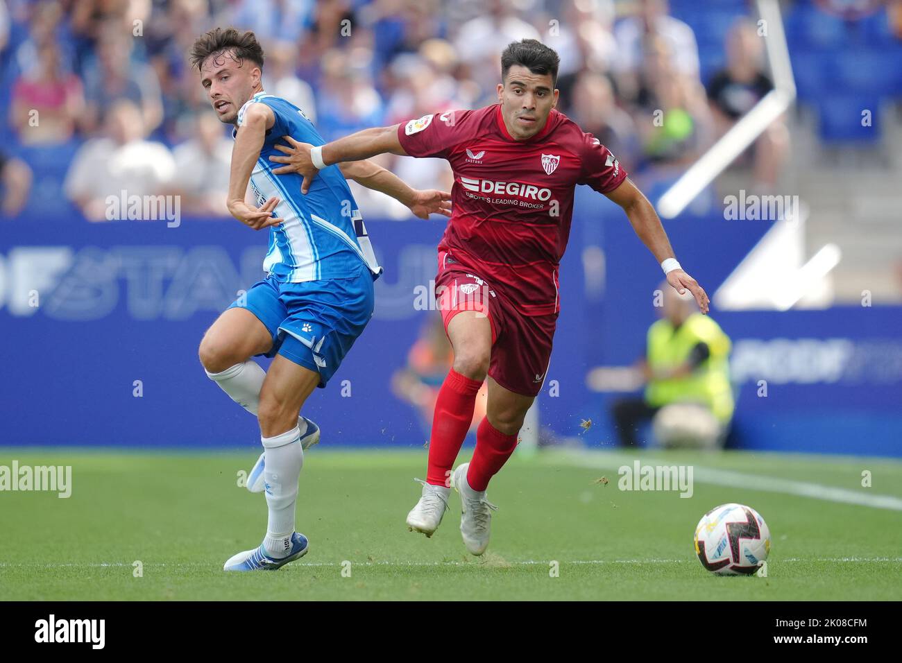 Marcos Javier Acuna of Sevilla FC and Javi Puado of RCD Espanyol  during the La Liga match between RCD Espanyol and Sevilla FC played at RCDE Stadium on September 9, 2022 in Barcelona, Spain. (Photo by Bagu Blanco / PRESSIN) Stock Photo