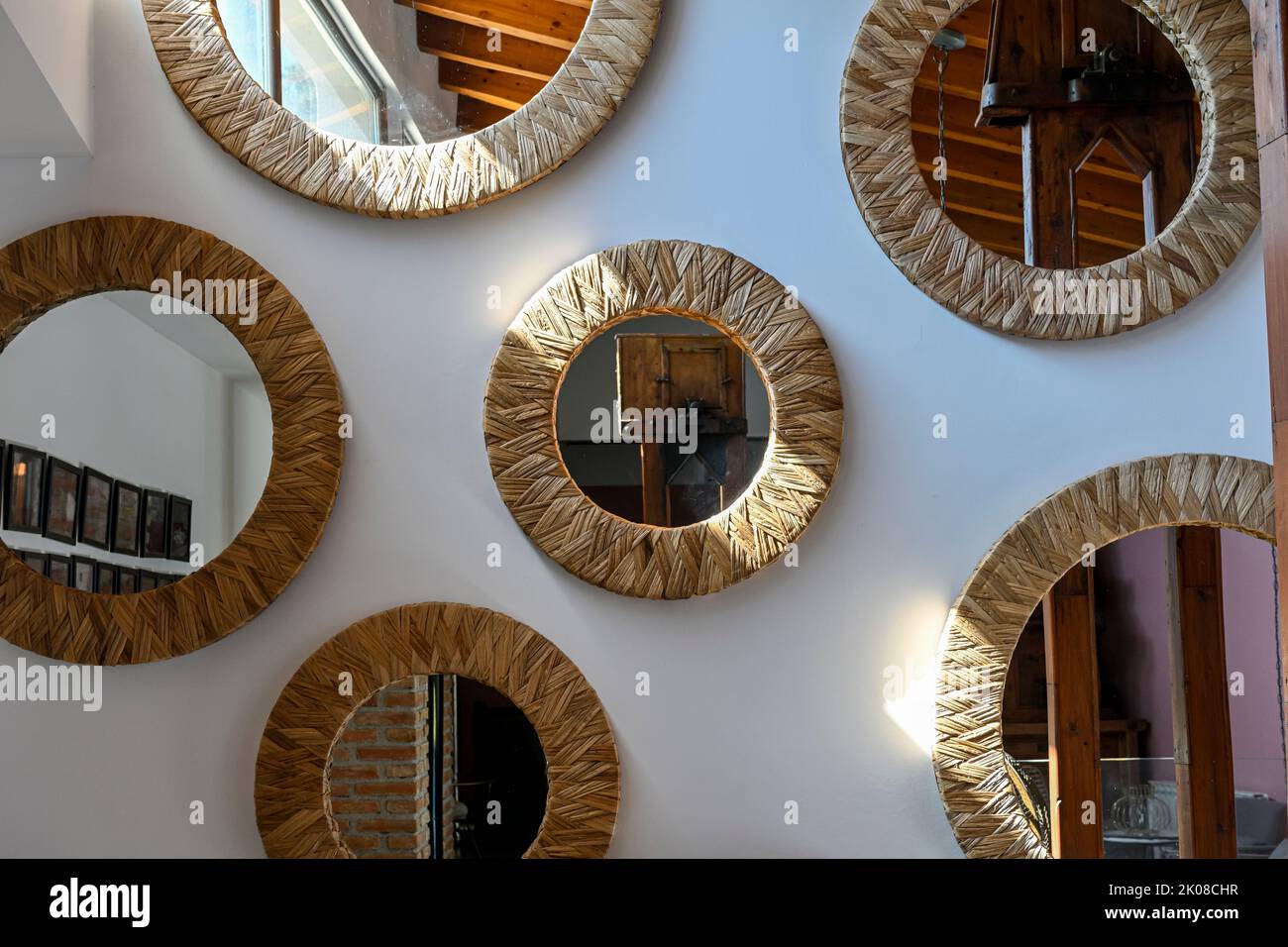 Room of round mirrors, placed on the wall Stock Photo Alamy