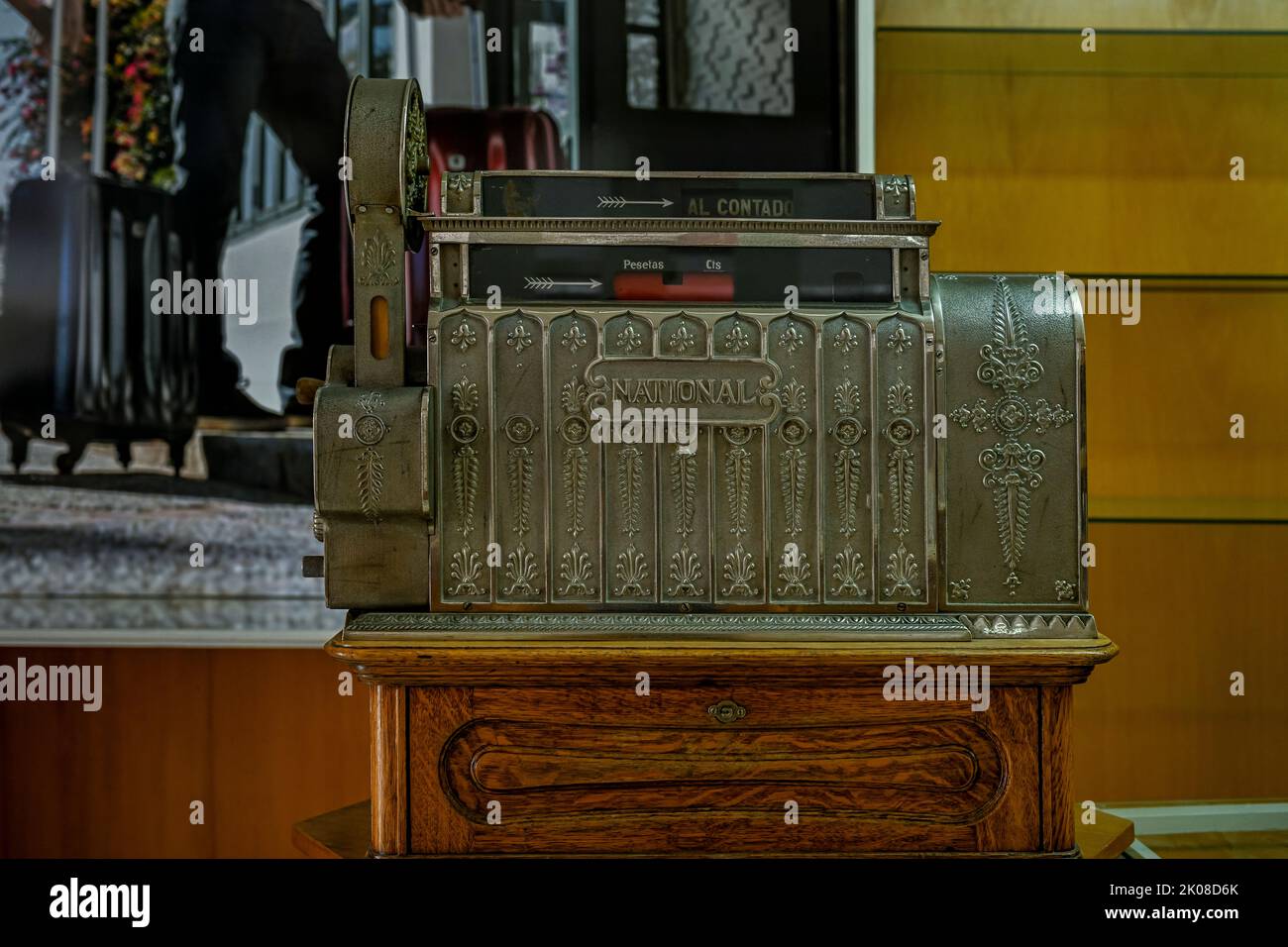 Antique crank-operated cash register, old metal. Stock Photo