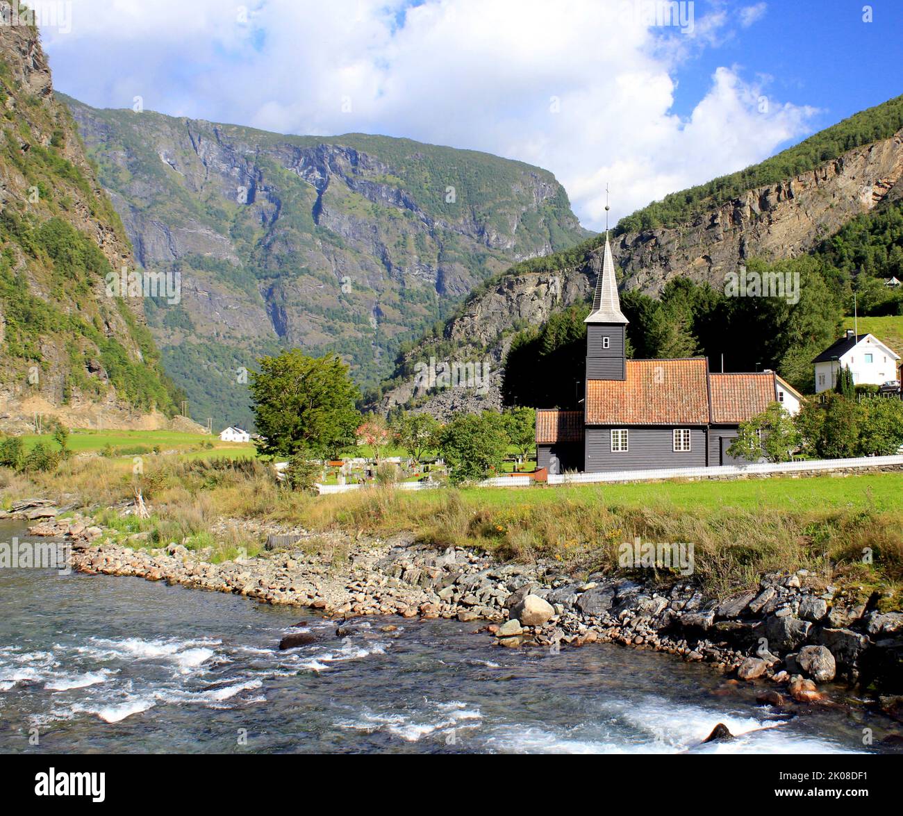 The wooden church set in the beautiful fjord valley in Flam in Norway Stock Photo