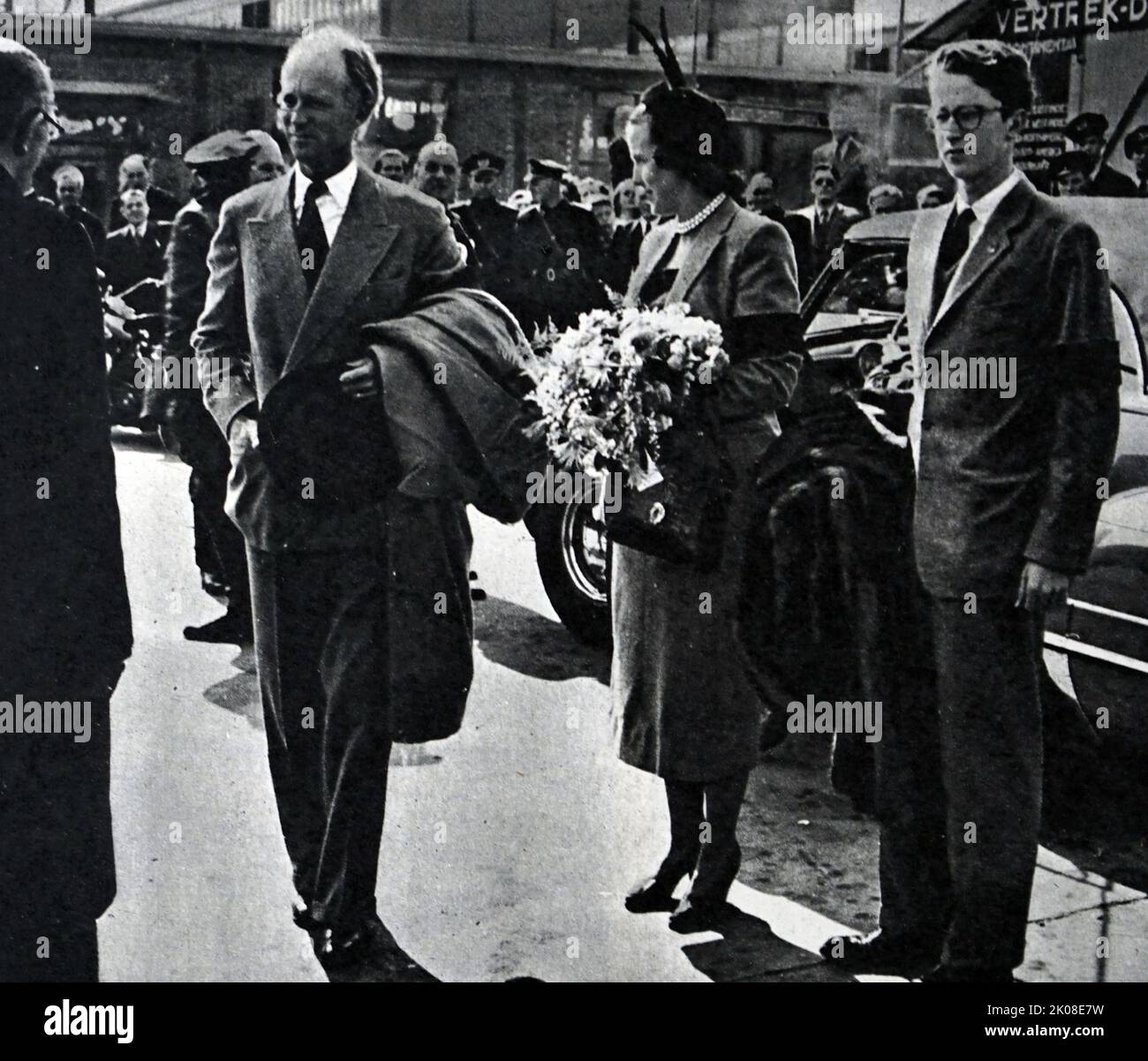 King Leopold of the Belgians, accompanied by Crown Prince Baudouin, with his second wife Princess of Rethy in Amsterdam. Leopold III (3 November 1901 - 25 September 1983) was King of the Belgians from 23 February 1934 until his abdication on 16 July 1951. Princess Lilian of Belgium, Princess of Rethy (born Mary Lilian Henriette Lucie Josephine Ghislaine Baels; 28 November 1916 - 7 June 2002). Baudouin was the elder son of King Leopold III (1901-1983) and his first wife, Princess Astrid of Sweden (1905-1935) Stock Photo