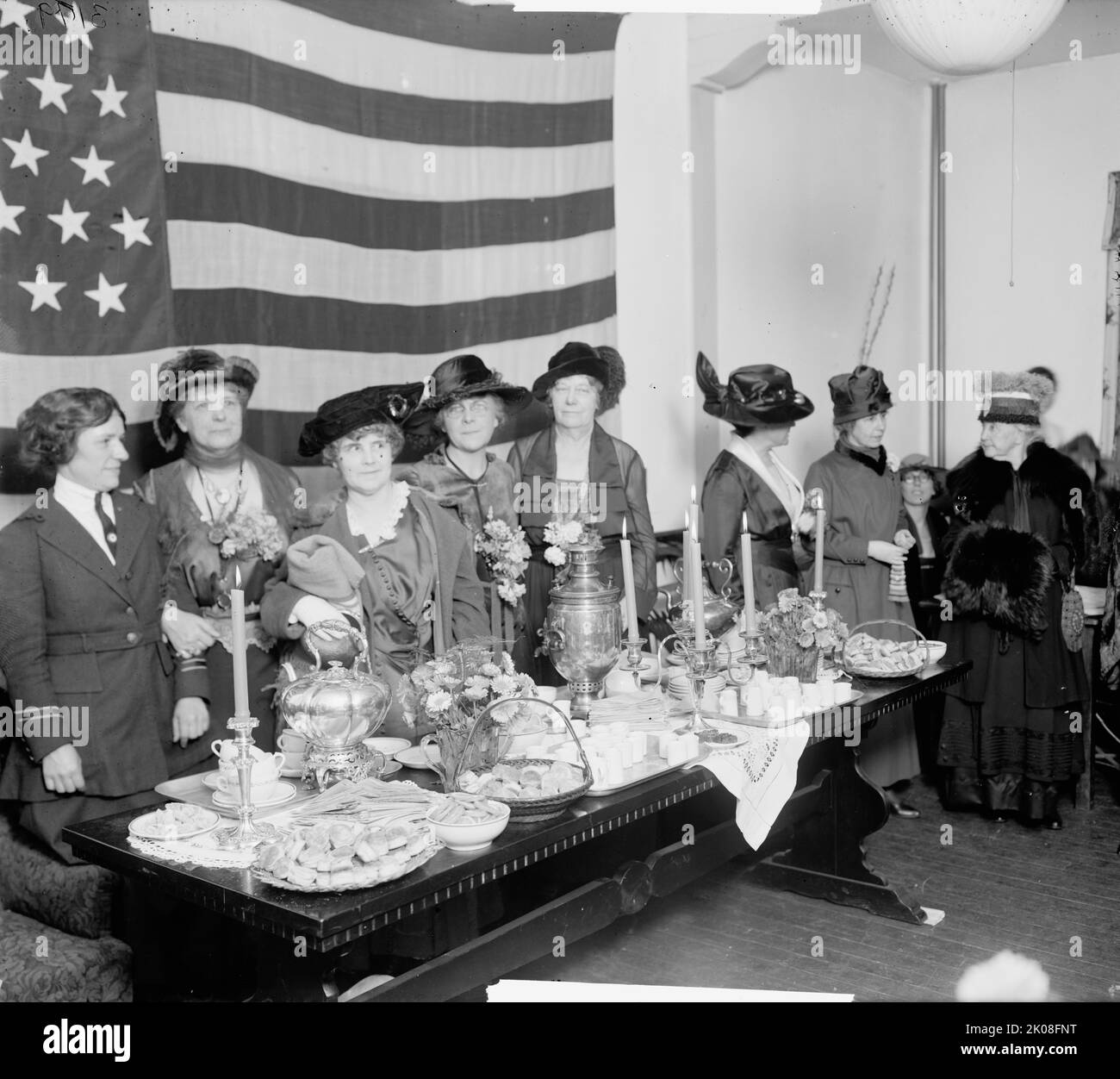 Walter Reed Hospital Bazaar, between 1910 and 1920. [Fundraising event: women with table of scones, teapot, slices of lemon, urn for hot water etc. Probably at the Walter Reed General Hospital, Washington, DC, now the Walter Reed Army Medical Center]. Stock Photo