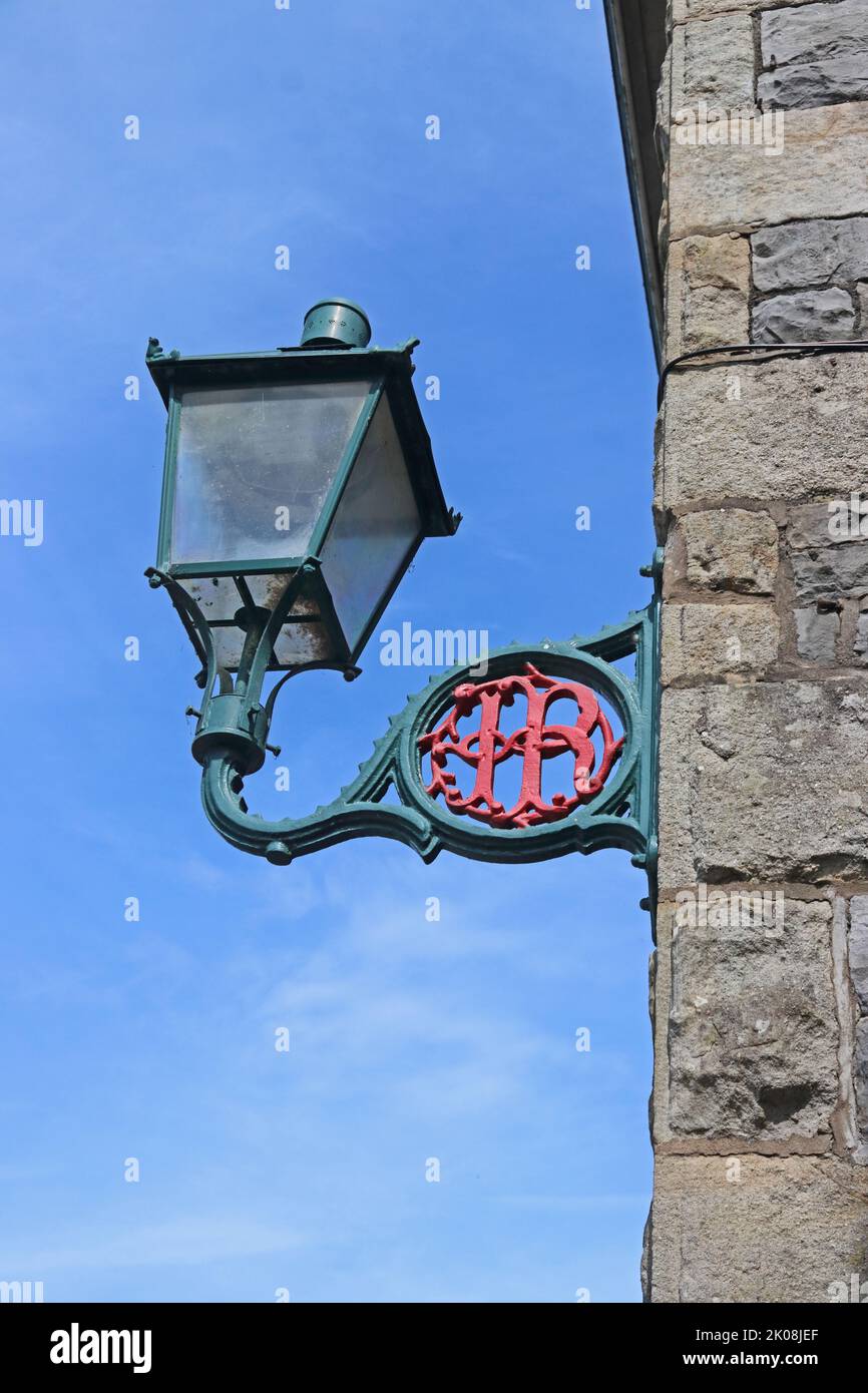 Ornate cast iron street light with entwined I and R in bracket Stock Photo