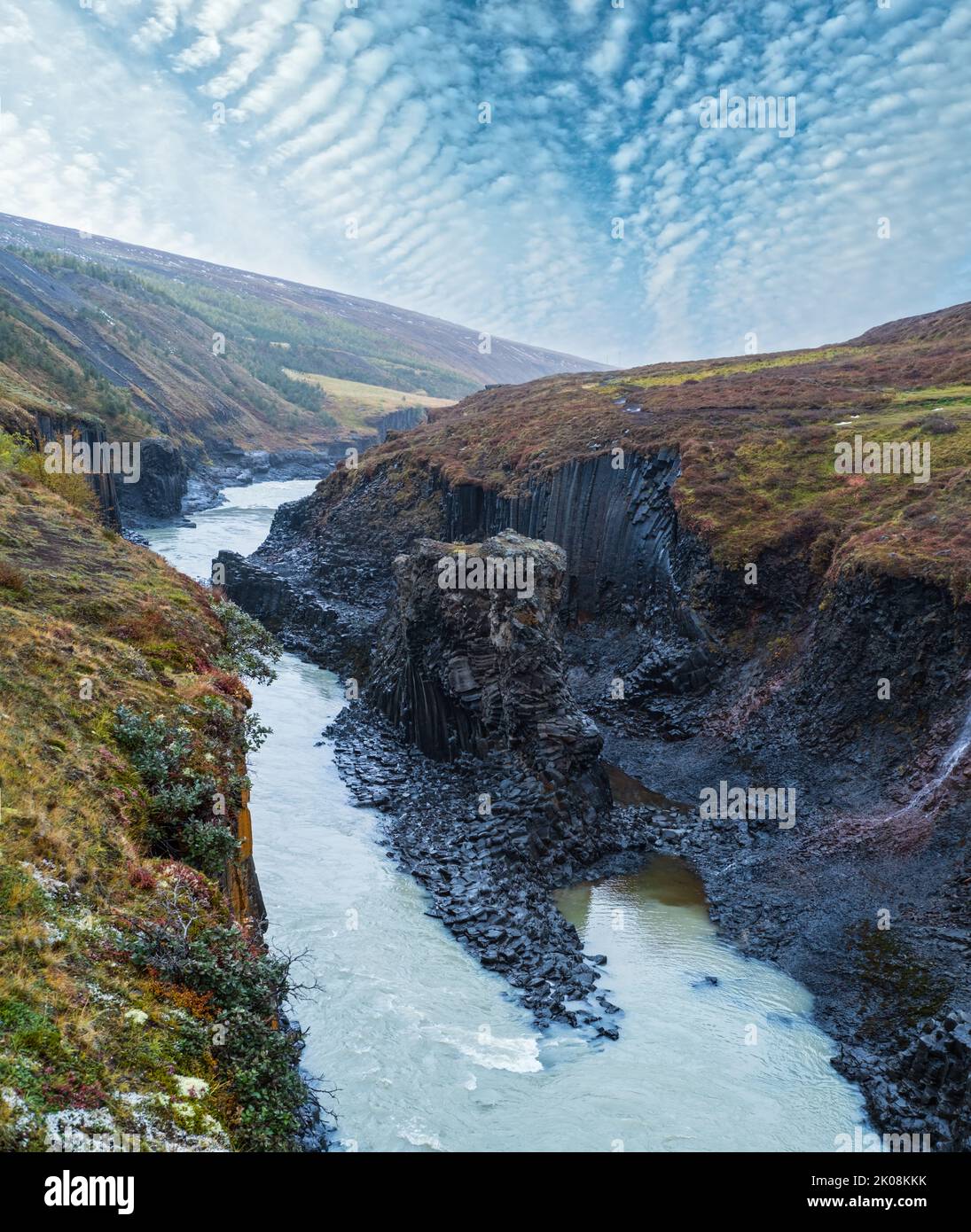 Autumn  picturesque Studlagil canyon is a ravine in Jokuldalur, Eastern Iceland. Famous columnar basalt rock formations and Jokla river runs through i Stock Photo