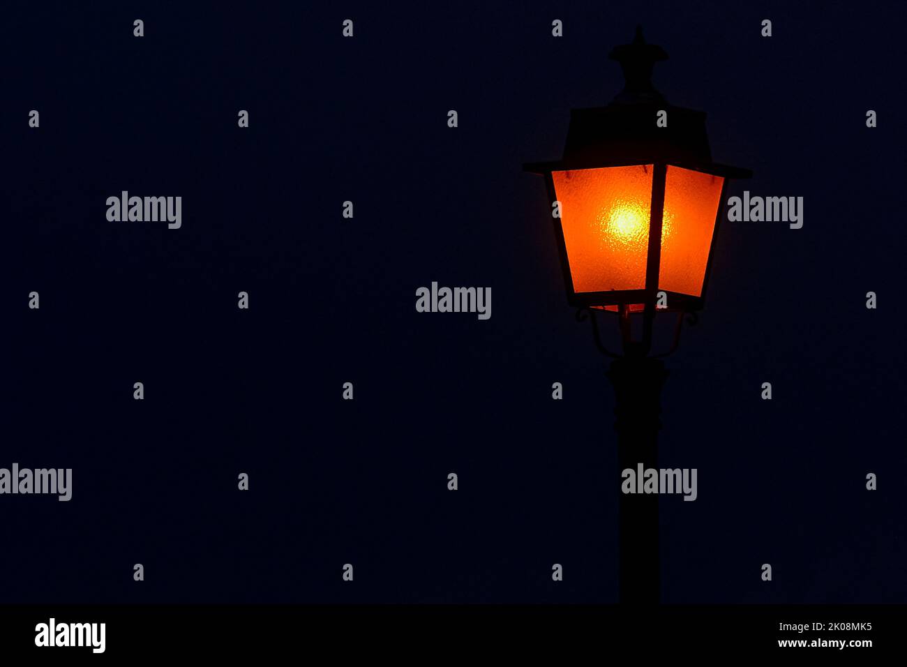 lamppost-illuminated-with-a-soft-orange-light-stock-photo-alamy