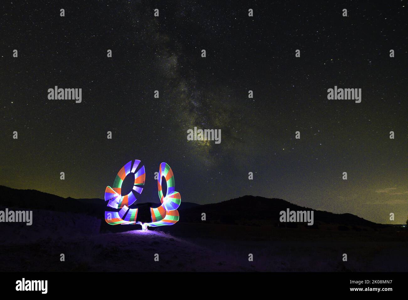 Night photography, light painting with the milky way in the background