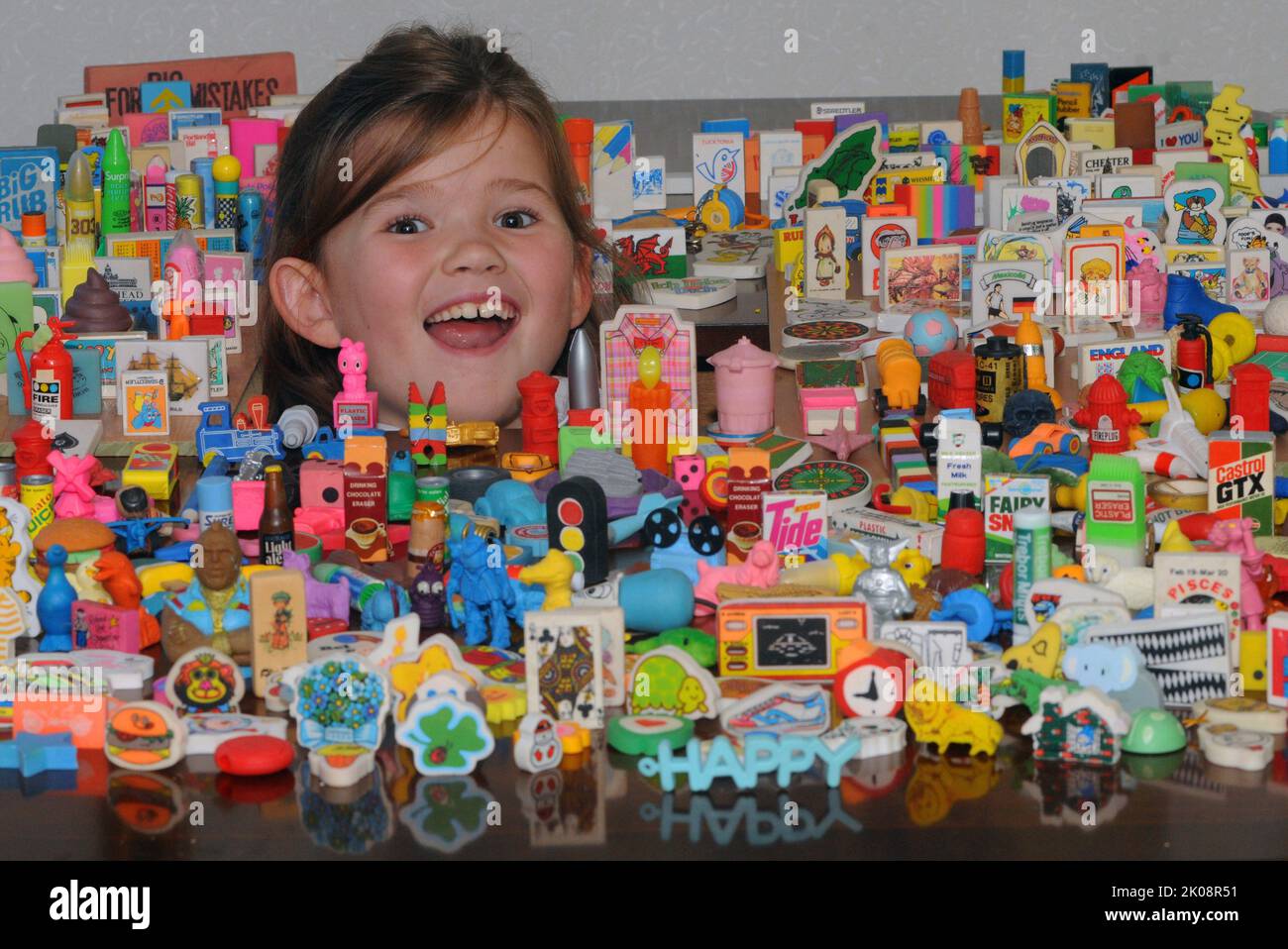 PIC MIKE WALKER, MIKE WALKER PICTURES  ERASERS  Hannah Walker can never be accused of rubbing her relatives up the wrong way after her Auntie Ally discovered a huge haul of 1,500 rubbers, many of them still in their original wrappers, in her loft.  Hannah, seven, had just started a collection of her own when Allison Walker, 41, found two suitcases full of them undisturbed in for up to 30 years.  The fascinating collection includes erasers in the shape of a whole variety of objects including packets of Tide, Surf and Fairy Liquid and others commemorating the 1986 World Cup, Cabbage Patch kids a Stock Photo