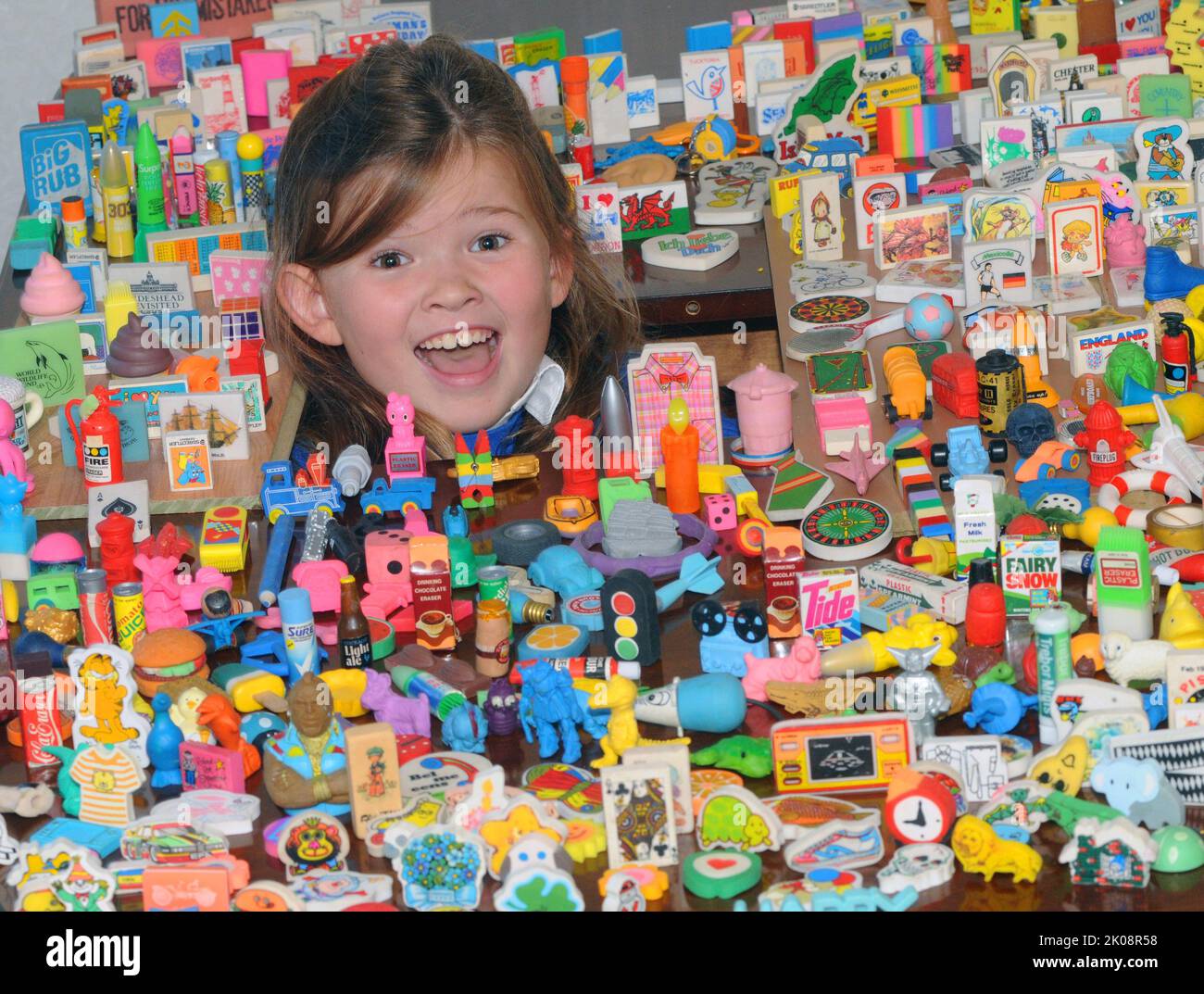 PIC MIKE WALKER, MIKE WALKER PICTURES  ERASERS  Hannah Walker can never be accused of rubbing her relatives up the wrong way after her Auntie Ally discovered a huge haul of 1,500 rubbers, many of them still in their original wrappers, in her loft.  Hannah, seven, had just started a collection of her own when Allison Walker, 41, found two suitcases full of them undisturbed in for up to 30 years.  The fascinating collection includes erasers in the shape of a whole variety of objects including packets of Tide, Surf and Fairy Liquid and others commemorating the 1986 World Cup, Cabbage Patch kids a Stock Photo