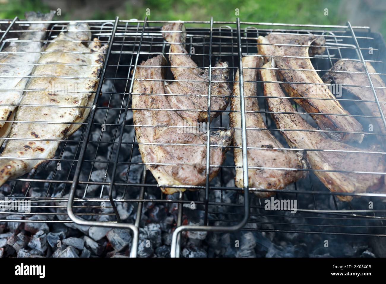 Cooking lamb loin on grill in backyard Stock Photo Alamy