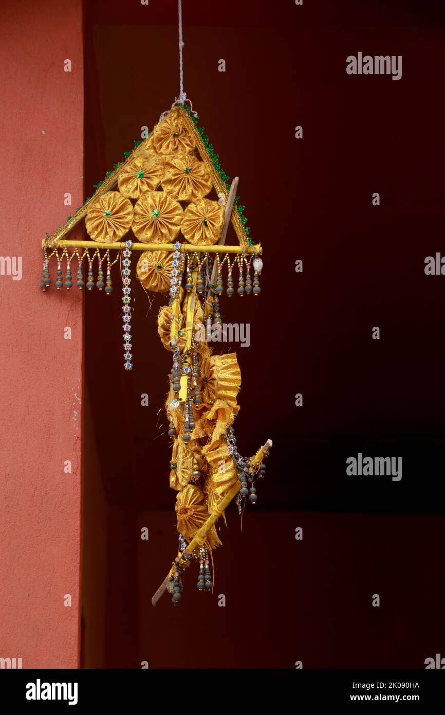 Golden colored Buddhist religious lantern hanged outside a Khmer Buddhist Temple in Kampot, Cambodia Stock Photo