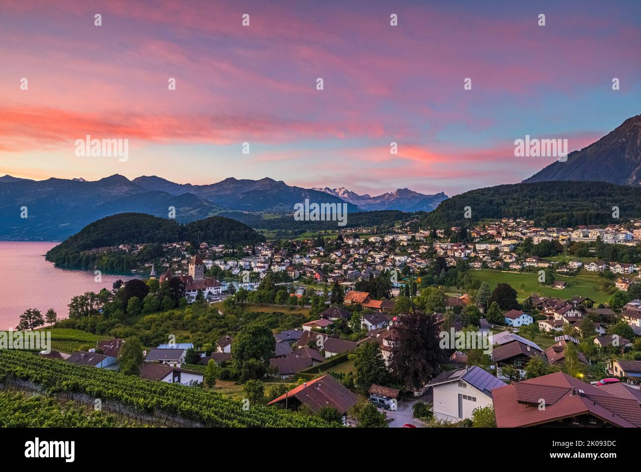 A beautiful summer sunrise in Spiez on Lake Thun, located in the Bernese Oberland. Spiez is part of the Swiss canton of Bern in central Switzerland. T Stock Photo