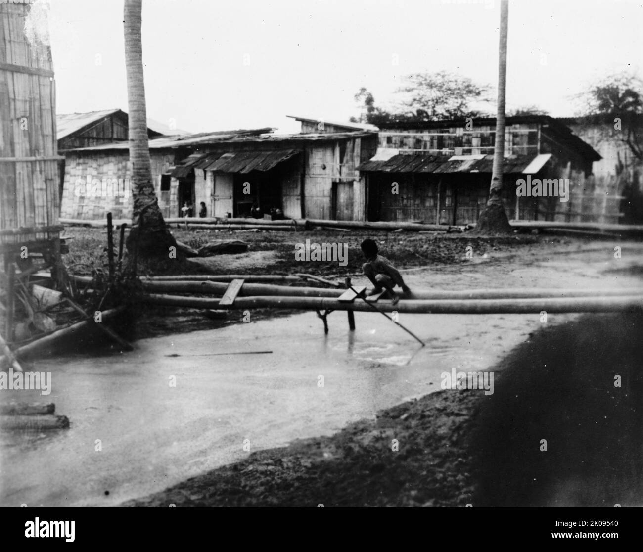 Ecuador - Scenes In Quayaquil [sic], Ecuador, 1912. River between houses, possibly during the rainy season. Stock Photo