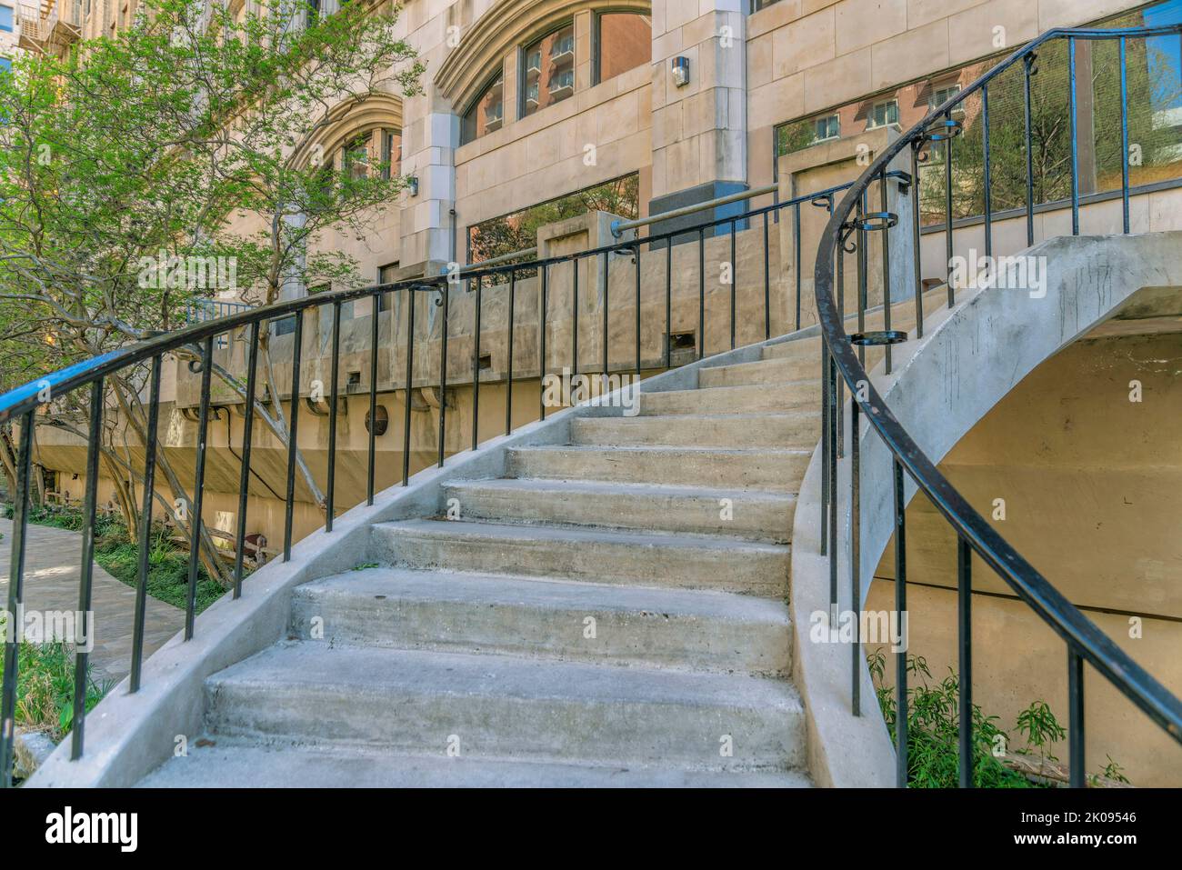 Stairs going up to buildings and bridge overlooking the San Antonio