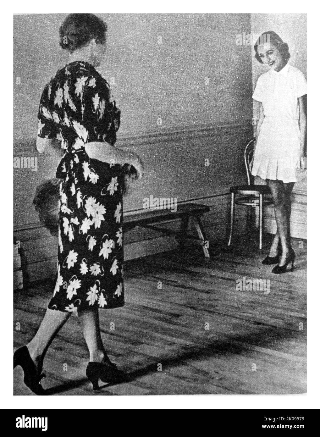 Debutantes learning to walk in the grand manner with teacher Josephine Bradley. Illustrated news cutting. Stock Photo