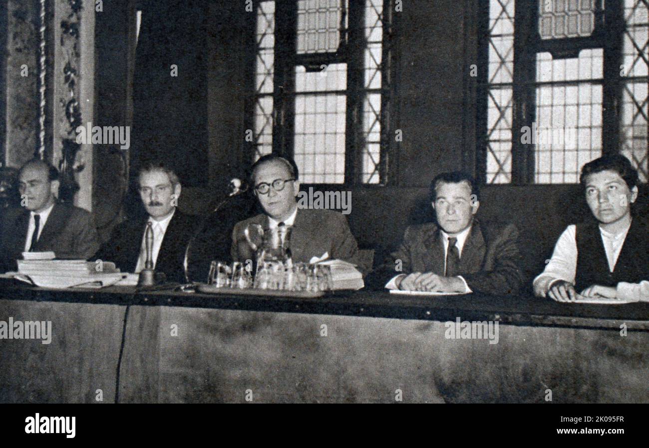 The bench of the People's Court of Yugoslavia. Pictured at the conceptual trial are Peter Janko, chairman of the court; Lajos Simon, a leather worker; and Mrs Konta, a factory worker. Stock Photo