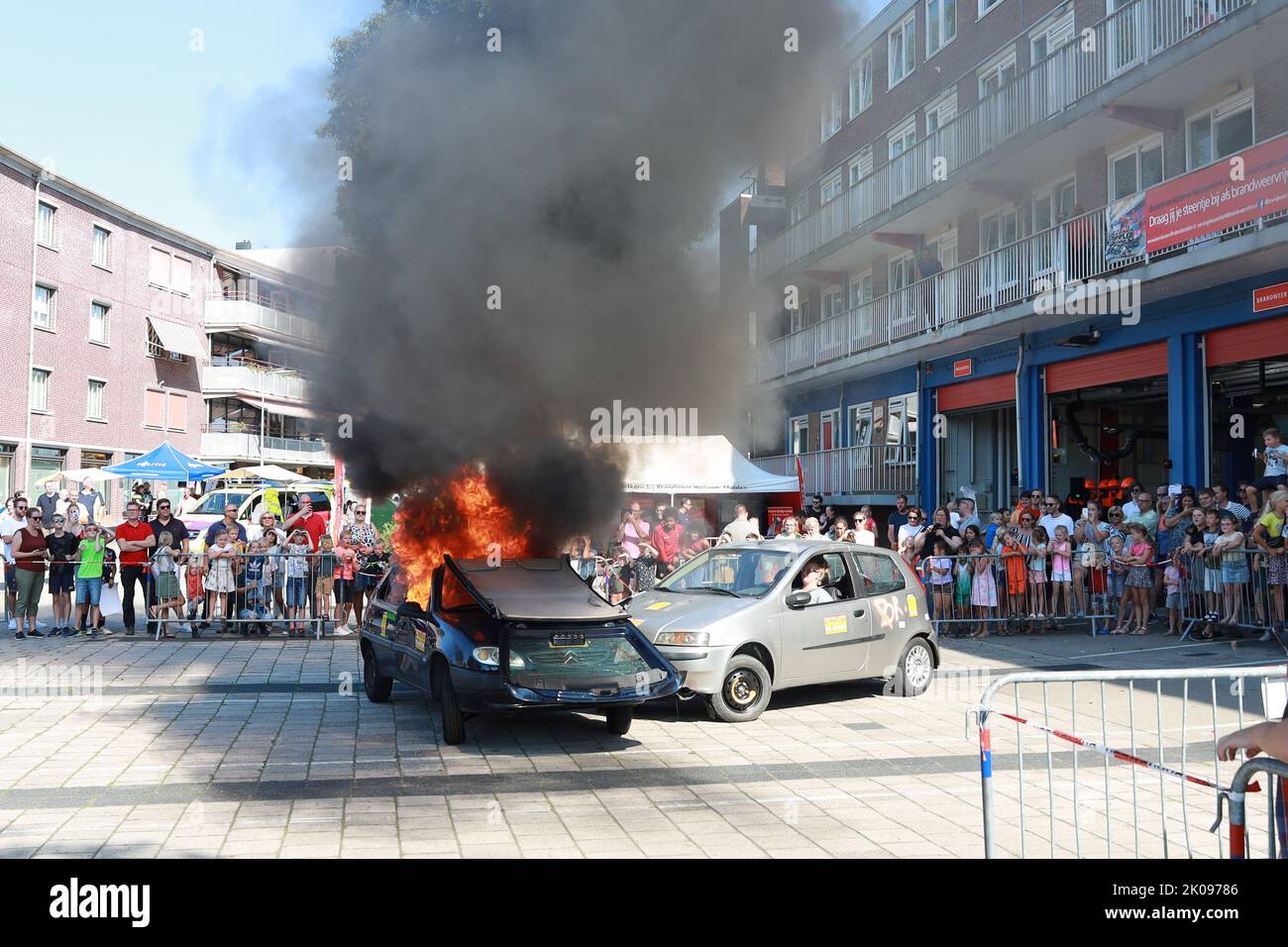 Demonstration of firefight with burning car with other car with driver after a crash in Nieuwerkerk during 112 day in the Netherlands Stock Photo